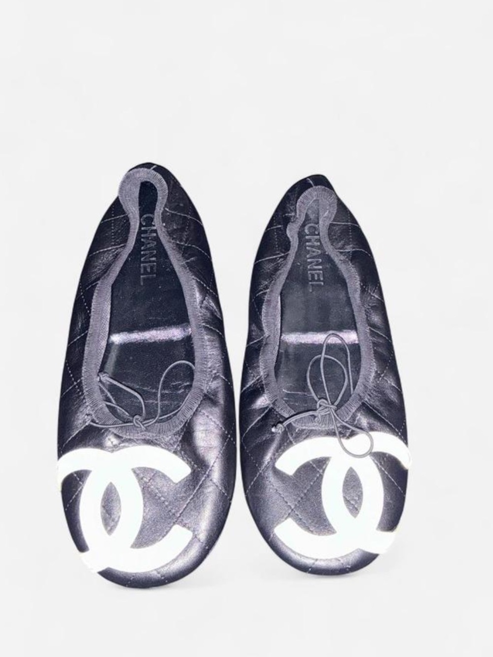 VTG CHANEL CC Quilted Black Flats with White Logo Cap Toe & Pink Bottom Soles.